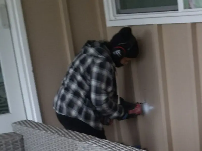 Professional electrician installing an exterior outlet in Virginia